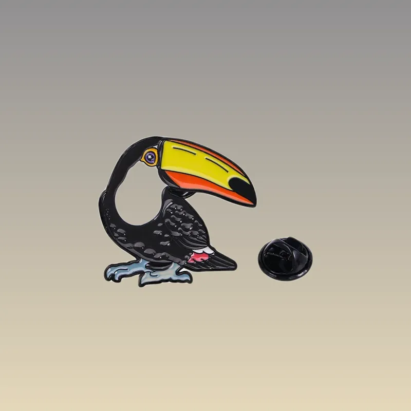 Découvrez le Pin's Animaux - Toucan, un accessoire tendance à ajouter à votre collection. Achetez-le dès maintenant pour égayer vos tenues !