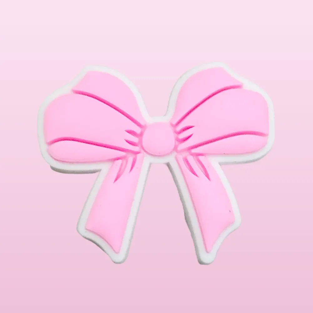 Achetez des pin's pour Crocs - Ruban rose et personnalisez vos chaussures avec style ! Optez pour une touche unique et féminine dès aujourd'hui.